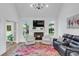 Inviting living room with a fireplace, comfortable seating, and a colorful rug, creating a cozy atmosphere at 2150 North Berwick Dr., Myrtle Beach, SC 29575