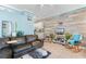 Cozy living room with comfortable seating, a TV, and an adjacent kitchen at 230 Addison Cottage Way, Murrells Inlet, SC 29576