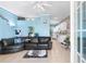 Bright living room with tile floors, comfortable seating, and an open layout at 230 Addison Cottage Way, Murrells Inlet, SC 29576