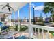 Charming porch with white railings, ceiling fan, and views of the street and other homes at 230 Addison Cottage Way, Murrells Inlet, SC 29576