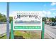 Welcome to Murrells Inlet Marsh Walk sign, depicting the waterfront attractions at 230 Addison Cottage Way, Murrells Inlet, SC 29576