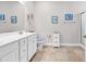 Clean bathroom with white cabinets, double sinks, and tiled floors at 232 Je Edward Dr. # 19, Myrtle Beach, SC 29588