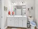 Bathroom featuring double sinks, a large mirror, and tile floors at 232 Je Edward Dr. # 19, Myrtle Beach, SC 29588