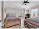 Bright bedroom featuring two beds, wood floors, and a ceiling fan at 232 Je Edward Dr. # 19, Myrtle Beach, SC 29588