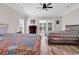 Bright bedroom featuring two beds, wood floors, and access to an outdoor area at 232 Je Edward Dr. # 19, Myrtle Beach, SC 29588