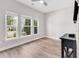 Bright bedroom featuring hardwood floors and multiple windows, creating a comfortable and inviting space at 232 Je Edward Dr. # 19, Myrtle Beach, SC 29588