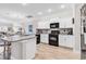 Modern kitchen featuring white cabinets, granite countertops, stainless appliances, and a center island with seating at 232 Je Edward Dr. # 19, Myrtle Beach, SC 29588