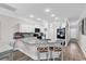Bright kitchen with white cabinetry, granite countertops, and stainless steel appliances at 232 Je Edward Dr. # 19, Myrtle Beach, SC 29588