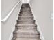 Carpeted staircase with white railings leads to the upper level at 232 Je Edward Dr. # 19, Myrtle Beach, SC 29588