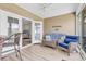 Sunroom with wicker furniture and an entrance to the bedroom at 232 Je Edward Dr. # 19, Myrtle Beach, SC 29588