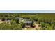 An aerial view showing the home nestled among lush trees, highlighting privacy and neighborhood charm at 250 Nature Trail, Little River, SC 29566