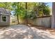 Wide parking pad in the backyard adjacent to a privacy fence and the home at 250 Nature Trail, Little River, SC 29566