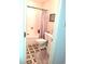 Clean and functional bathroom with tiled floors, shower with curtain, and compact vanity at 250 Nature Trail, Little River, SC 29566