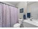 Charming bathroom with shell-themed shower curtain, offering a serene and relaxing space at 250 Nature Trail, Little River, SC 29566