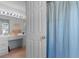Bathroom vanity and separated shower behind a door at 250 Nature Trail, Little River, SC 29566