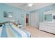Tranquil bedroom with closet, white dresser, and view to another room at 250 Nature Trail, Little River, SC 29566