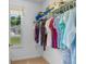 Walk-in closet with ample storage, clothing rack, and window at 250 Nature Trail, Little River, SC 29566