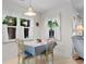 Charming dining area featuring sunny windows and seating for four guests at 250 Nature Trail, Little River, SC 29566