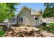 Side view of home featuring light siding, landscaped yard, and a view of a neighboring house at 250 Nature Trail, Little River, SC 29566