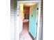 Inviting front entrance featuring a turquoise door, offering a glimpse into the home's bright interior at 250 Nature Trail, Little River, SC 29566