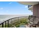 Balcony with wrought iron railing and seating overlooks ocean and beach, for relaxing outdoors at 2500 N Ocean Blvd. # 601, Myrtle Beach, SC 29577