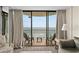 Balcony view through large glass doors in the living room; ocean view at 2500 N Ocean Blvd. # 601, Myrtle Beach, SC 29577
