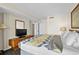 Well-lit bedroom with patterned bedding, TV, and closet space for your comfort at 2500 N Ocean Blvd. # 601, Myrtle Beach, SC 29577