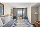 Comfortable bedroom offers balcony access and a serene coastal view at 2500 N Ocean Blvd. # 601, Myrtle Beach, SC 29577