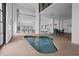 Relaxing indoor hot tub area with tables and chairs, doors to the outside, and clean blue water at 2500 N Ocean Blvd. # 601, Myrtle Beach, SC 29577