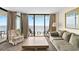 Bright living room with balcony access showcasing stunning ocean views at 2500 N Ocean Blvd. # 601, Myrtle Beach, SC 29577