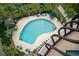 Overhead view of the community pool surrounded by mature landscaping and seating areas at 2500 N Ocean Blvd. # 601, Myrtle Beach, SC 29577