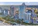Stunning aerial view of beachfront condos with pools and lush landscaping at 2504 N Ocean Blvd. # 2030, Myrtle Beach, SC 29577