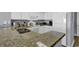 Bright kitchen with granite countertops, modern appliances, and ample cabinet space at 2504 N Ocean Blvd. # 2030, Myrtle Beach, SC 29577