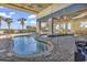 Exterior view of covered pool area with palm trees and lounge chairs at 2504 N Ocean Blvd. # 2030, Myrtle Beach, SC 29577