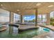 Exterior view of covered pool area with lounge chairs and natural light at 2504 N Ocean Blvd. # 2030, Myrtle Beach, SC 29577