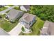 Aerial view of a two-story home with gray siding, a well-manicured lawn and mature landscaping at 278 Carolina Crossing Blvd., Little River, SC 29566