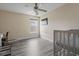 This bedroom features woodgrain floors, a ceiling fan, and a window that provides natural light at 278 Carolina Crossing Blvd., Little River, SC 29566