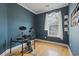 Blue bedroom with hardwood floors, a window, and an electronic drum set at 278 Carolina Crossing Blvd., Little River, SC 29566