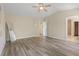 Spacious bedroom with hardwood floors, ceiling fan, and ample closet space, providing comfort and functionality at 278 Carolina Crossing Blvd., Little River, SC 29566