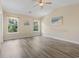 Bright main bedroom with natural light, hardwood floors, a ceiling fan and vaulted ceiling at 278 Carolina Crossing Blvd., Little River, SC 29566