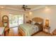 Bright bedroom featuring a ceiling fan and access to a private balcony at 2790 Fowler Rd., Loris, SC 29569
