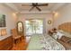 Bright bedroom featuring a ceiling fan and access to a private balcony at 2790 Fowler Rd., Loris, SC 29569