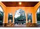 Picturesque arched veranda with decorative stone accents and views of the serene landscape, blending indoor and outdoor living at 2790 Fowler Rd., Loris, SC 29569