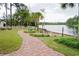 Picturesque waterfront property with a brick path, garden, dock, and stunning lake views at 2790 Fowler Rd., Loris, SC 29569