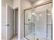 Bright bathroom featuring a glass enclosed shower with white tile and open door at 307 Dunlin Pl, Conway, SC 29526