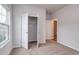 Bright bedroom featuring plush carpet, a closet and a doorway to another room at 307 Dunlin Pl, Conway, SC 29526