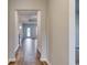 Inviting hallway with wood-look flooring and an open view of the kitchen and living area at 307 Dunlin Pl, Conway, SC 29526