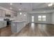 Open-concept kitchen with a center island, stainless steel appliances, and hardwood flooring at 307 Dunlin Pl, Conway, SC 29526