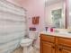 Cozy bathroom featuring a shower-tub combo, tile flooring, and a wood vanity with a sink at 310 Kiskadee Loop # D, Conway, SC 29526