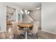 Bright dining area with a round table and stairway access, complemented by natural light at 310 Kiskadee Loop # D, Conway, SC 29526